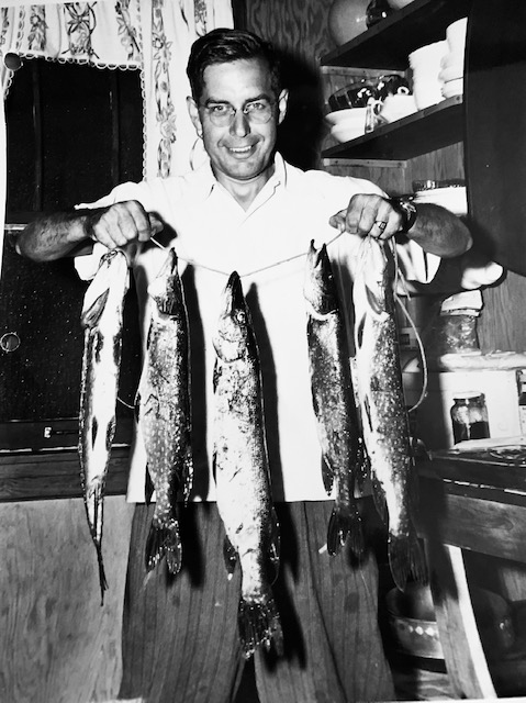Raymond Hunholz holding several fish